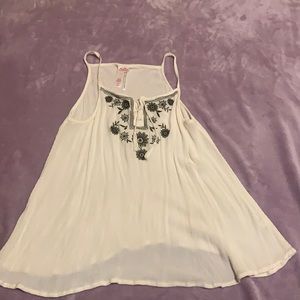 Justice white tank top, size 18 in kids.